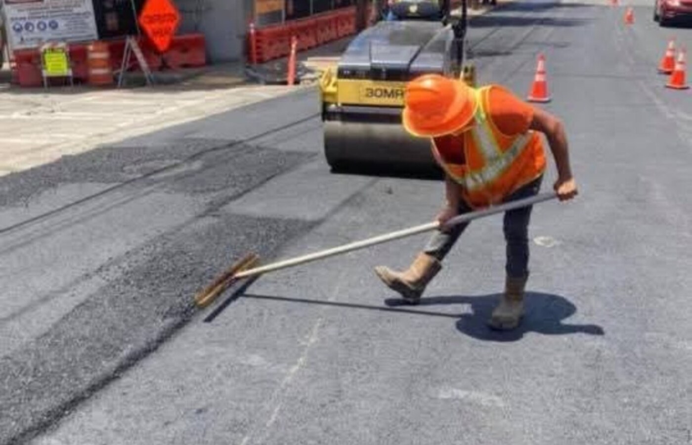 Commercial asphalt crew working on a city street