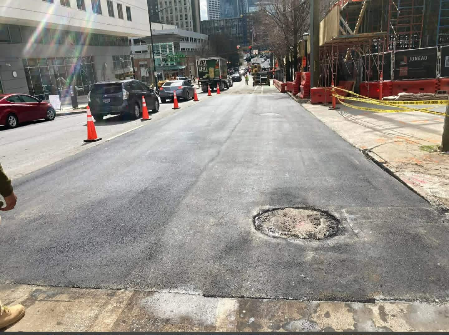 Completed asphalt patching on a city street